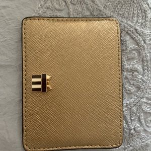 Henri bendel card holder in gold color